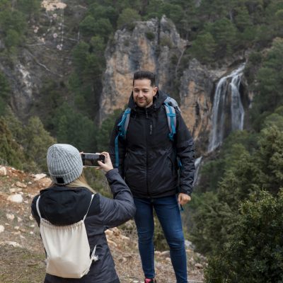 couple-nature-taking-photos-with-mobile